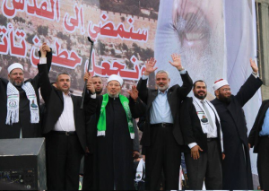 Salah Sultan (2nd from right) at Hamas Rally with Qaradawi