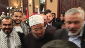 Sultan (left) with Qaradawi and Haniyeh in Gaza